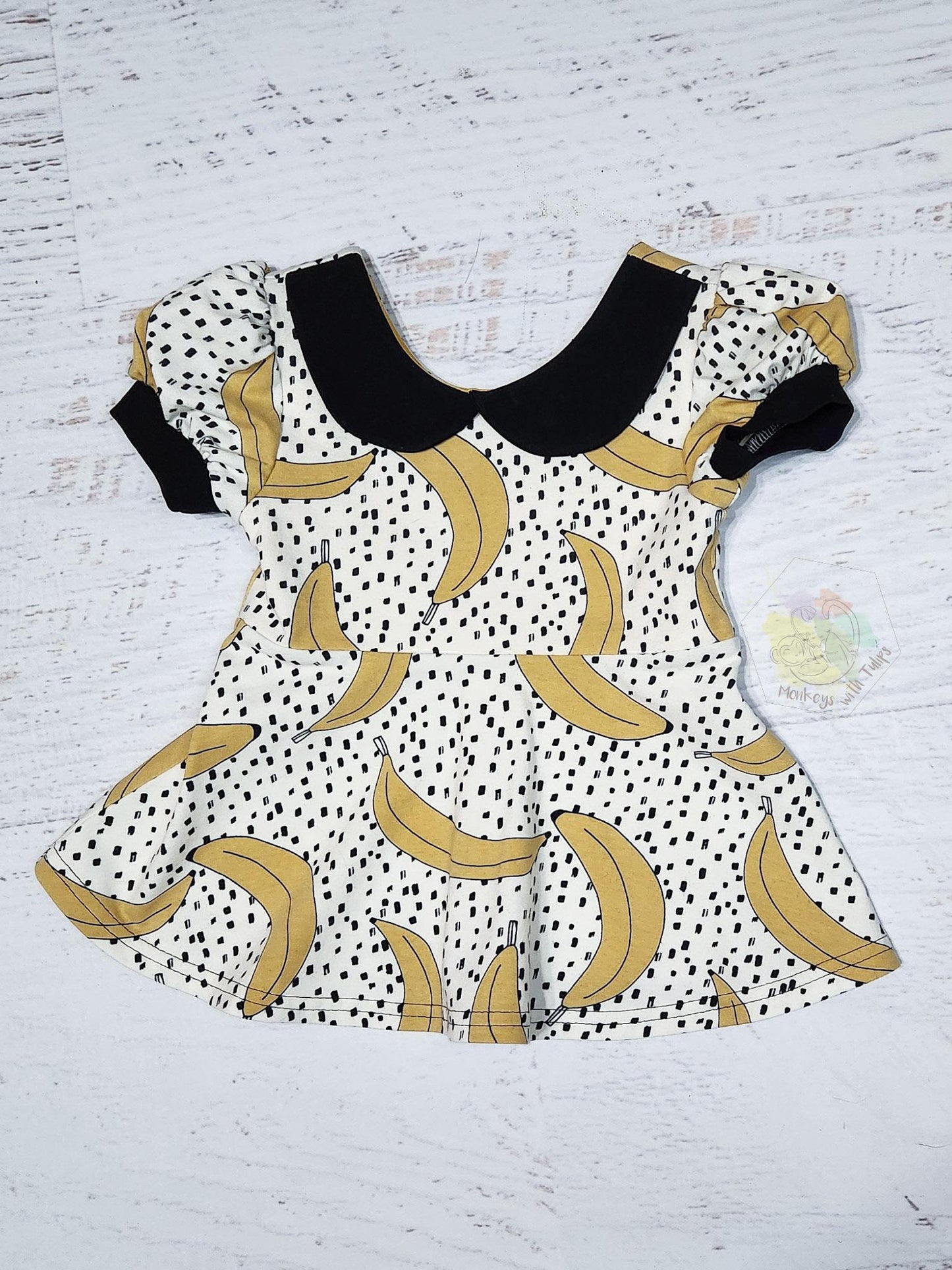 Collared banana print peplum, size  2t