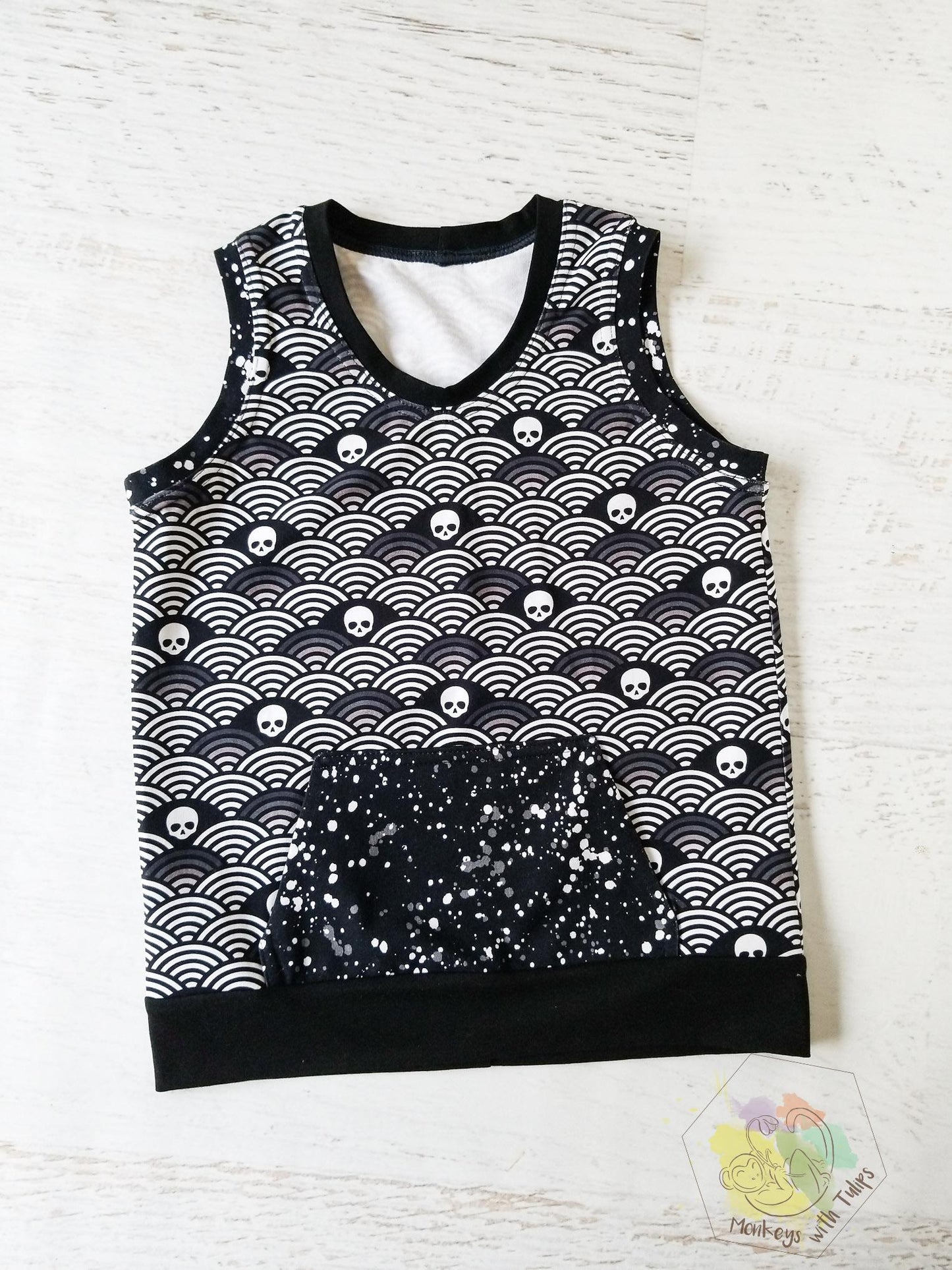 Monochrome skulls and rainbows tank, front pocket, size 8